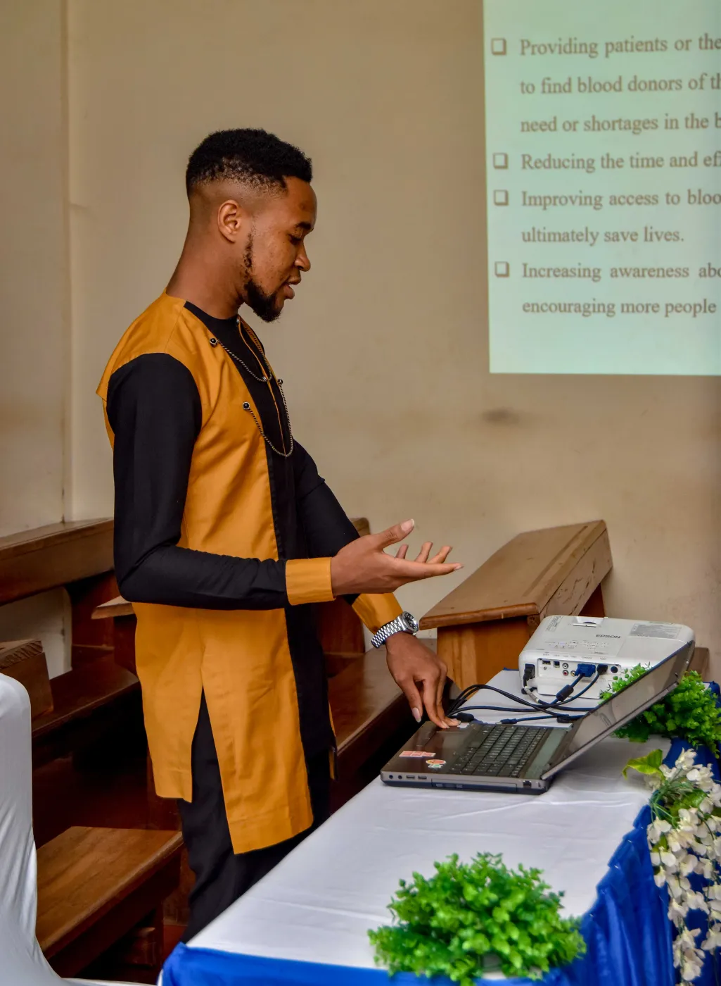 Nsom Emmanuel presenting his engineering project to a panel