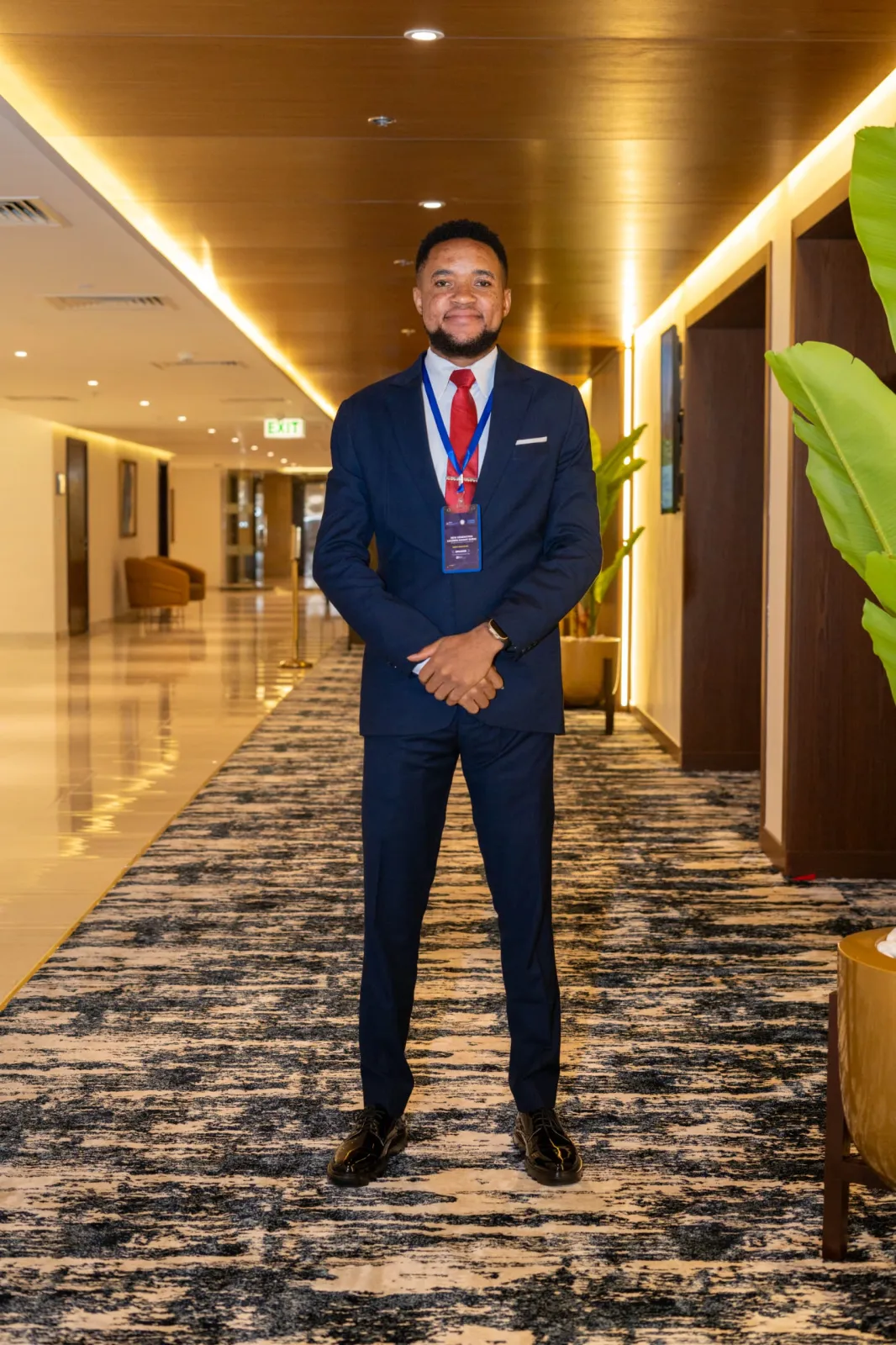 Nsom Emmanuel — navy suit, full length
